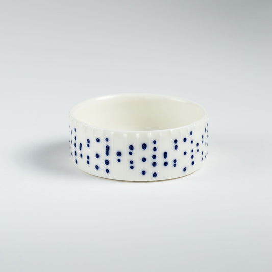Handmade porcelain ramekin with blue slip-trailed dot decoration