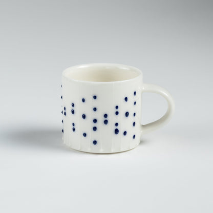 Handmade porcelain espresso cup with blue dotted pattern