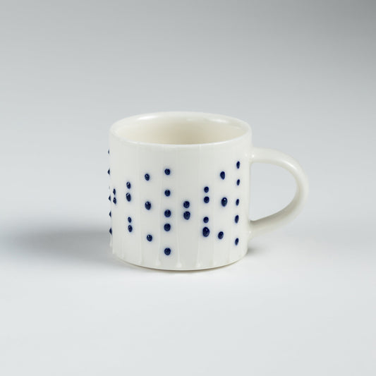 Handmade porcelain espresso cup with blue dotted pattern