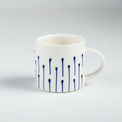 Handmade porcelain small coffee mug with blue slip-trailed line decoration