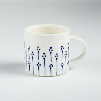 Handmade porcelain small coffee mug with blue slip-trailed floral pattern decoration