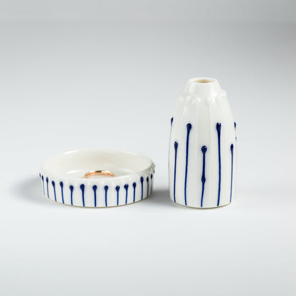 Handmade porcelain mini vase and ring dish gift set with blue slip-trailed line decoration.