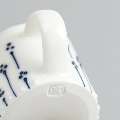 Handmade porcelain espresso cup with maker's mark shown on the base