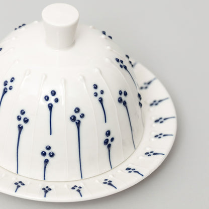 Handmade porcelain butter dish with lid and blue slip-trailed floral pattern