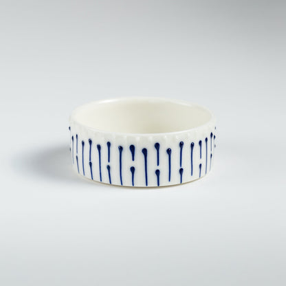 Handmade porcelain ramekin with blue slip-trailed line decoration